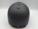 a close up of a black helmet on a white surface
