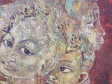 a painting of a woman and a child on the wall