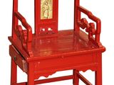 a red chair that has a picture on the back of it