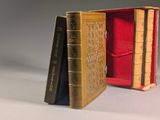 two books that are sitting in a red case