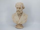 marble bust of a man with a beard wearing a suit