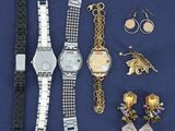 several pieces of jewelry including a watch, bracelets, and earrings