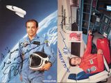 an image of a man in a space suit and a woman in a space suit