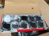 a cardboard box with a bunch of electronic parts inside of it