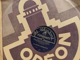 a brown paper bag with a vinyl record on it