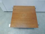 a wooden table that is sitting on the floor