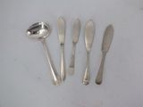 four spoons and two spoons on a white surface
