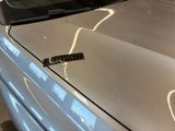 a sticker on the hood of a car that has lightning coming out of it