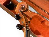 a violin that is sitting in a case on the floor