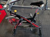 a bike that is sitting on the floor in the gym