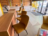 a room with a lot of chairs and a table