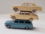 three toy cars stacked on top of each other on a table