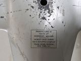 a close up of a piece of metal with a sign on it