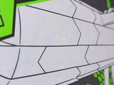 a close up of a box with a green and black design on it