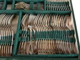 a green box with a set of silverware in it