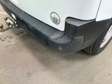 a close up of the front bumper of a white truck