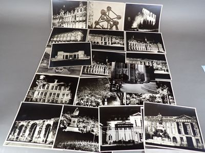 several black and white photos of a bunch of buildings on a table