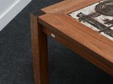 a coffee table with a picture on it on the floor