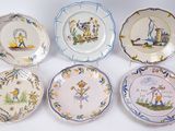 six plates with different designs on them on a white surface