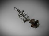 a metal object that is hanging on the wall