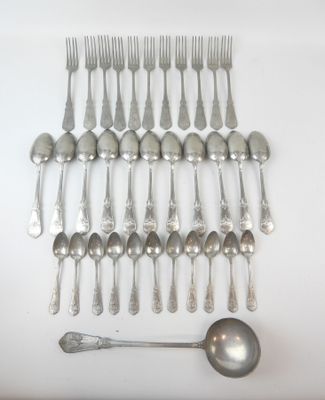a lot of silver spoons and spoons on the table