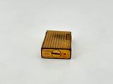 a small brown radio sitting on a white surface
