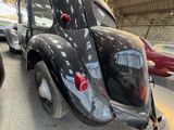 a black car that is parked in a garage