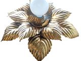a gold flower with a white light on it
