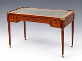 an antique mahogany writing table with marble top