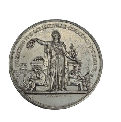 an old silver coin with a statue of a woman holding a bird