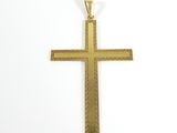 a gold cross pendant on a white background