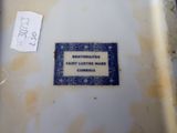 a label on the bottom of a bowl that is dirty
