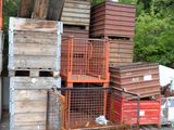 a lot of crates stacked up on the side of the road