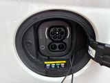 a close up of a car ' s plugged in to a charger