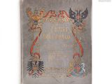 un vieux livre sur lequel figure l'image d'un aigle et d'une couronne
