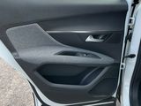 the interior of a car with the door open and a seat in the passenger seat