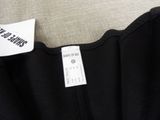 the label is on the back of a black dress on a mannequin mannequin mannequin mannequin mannequin mannequin manne