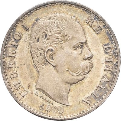 Gros plan sur une pièce de monnaie portant le visage d'un homme