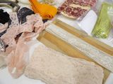 many different types of laces and scissors on a table