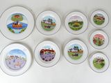 nine plates with different designs on them on the wall