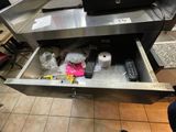 a drawer that has a lot of items inside of it