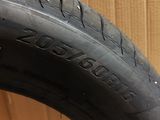 a close up of a tire on a box with a cardboard box in the background