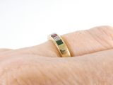 a close up of a person ' s hand with a ring on it