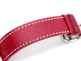 red leather watch strap with white stitching on a white background