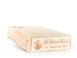 a wooden box with a label on it on a white surface