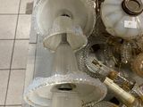a lot of silver and gold items on the floor