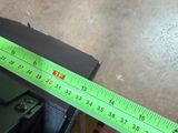 a measuring tape that is on top of a piece of wood