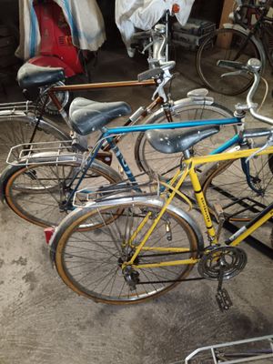 two bicycles parked next to each other in a garage