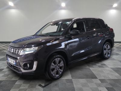 the new suzuki grand vitax is parked in the showroom