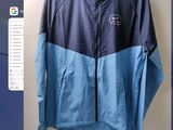 a picture of a blue and blue jacket on a hanger